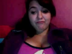 Chubby dark brown shows off her bottom and breasts to the camera.